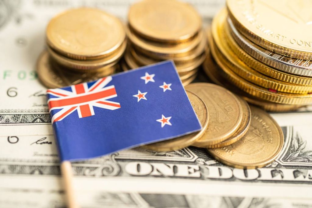 Stack of coins money with New Zealand flag, finance banking concept.